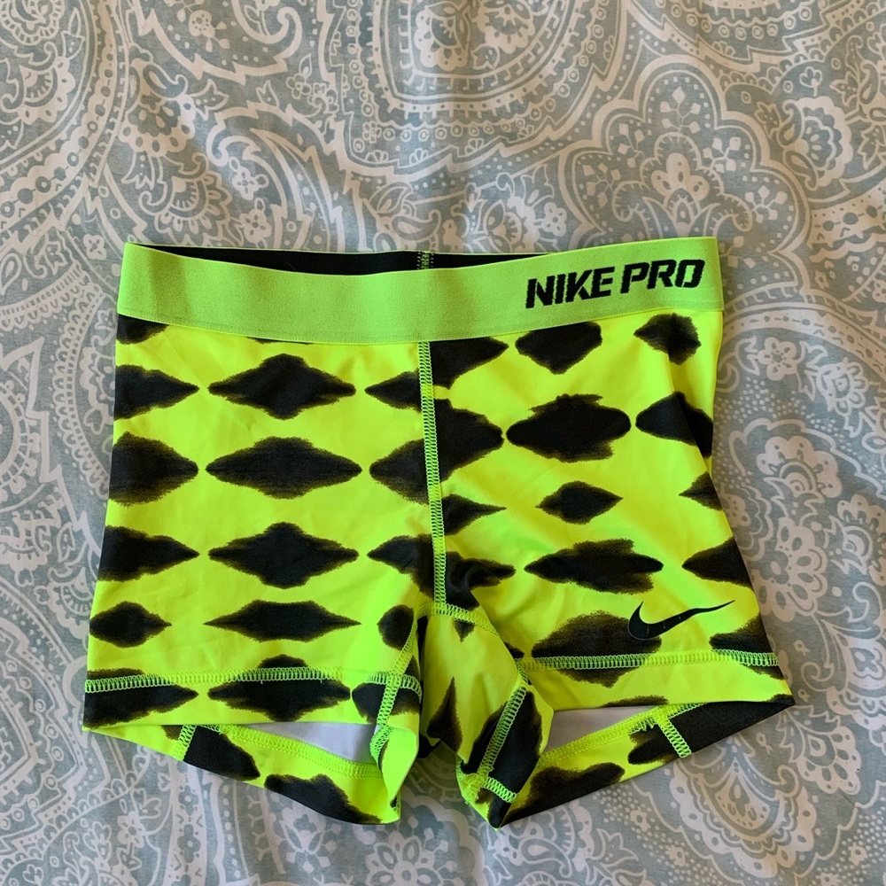 Three neon green nike spandex